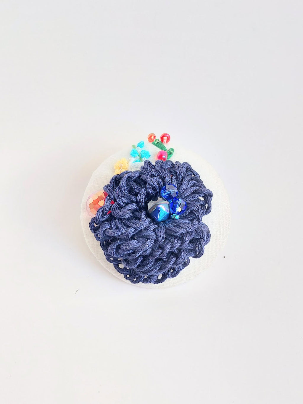 Decorative blue flower brooch on white  background